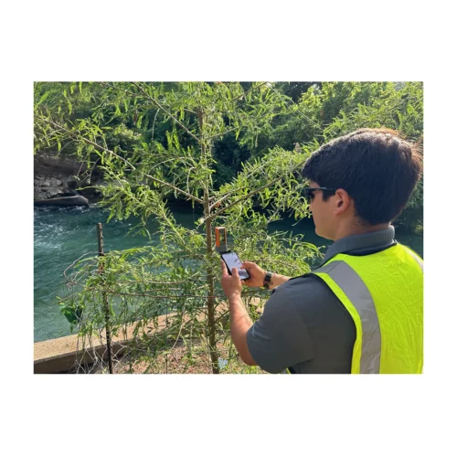 Bad Elf Flex Mini attached to phone used in field