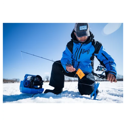Clam Outdoors Arctic Warrior Tip Up with rod in the field