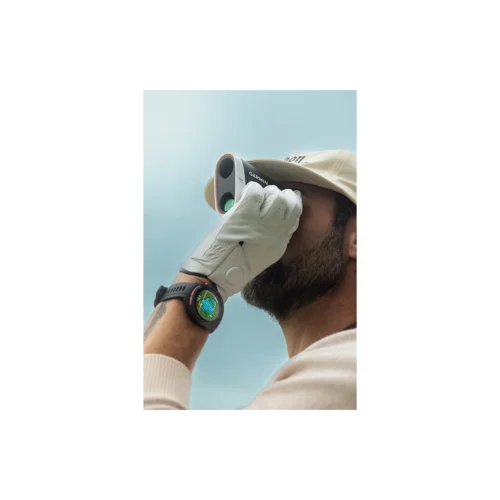 Man using Garmin Approach Z30 golf rangefinder with a Garmin golf smartwatch