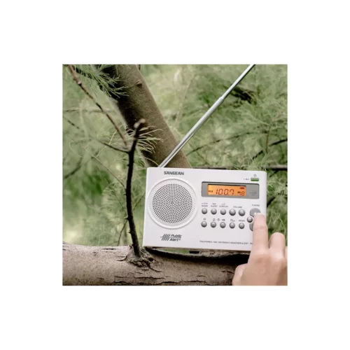Sangean PR-D9W Portable AM / FM Stereo Radio in white on tree branch with button being pressed