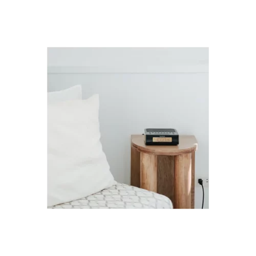 Sangean RCR-5 AM/FM Digital Tuning Radio in black on sidetable plugged into wall