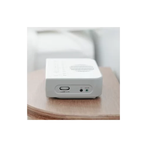 Sangean RCR-5 AM/FM Digital Tuning Radio in white sitting on desk with right side showing